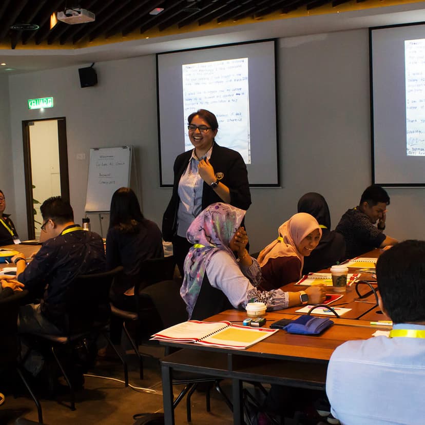 Corporate training class with facilitator and participants